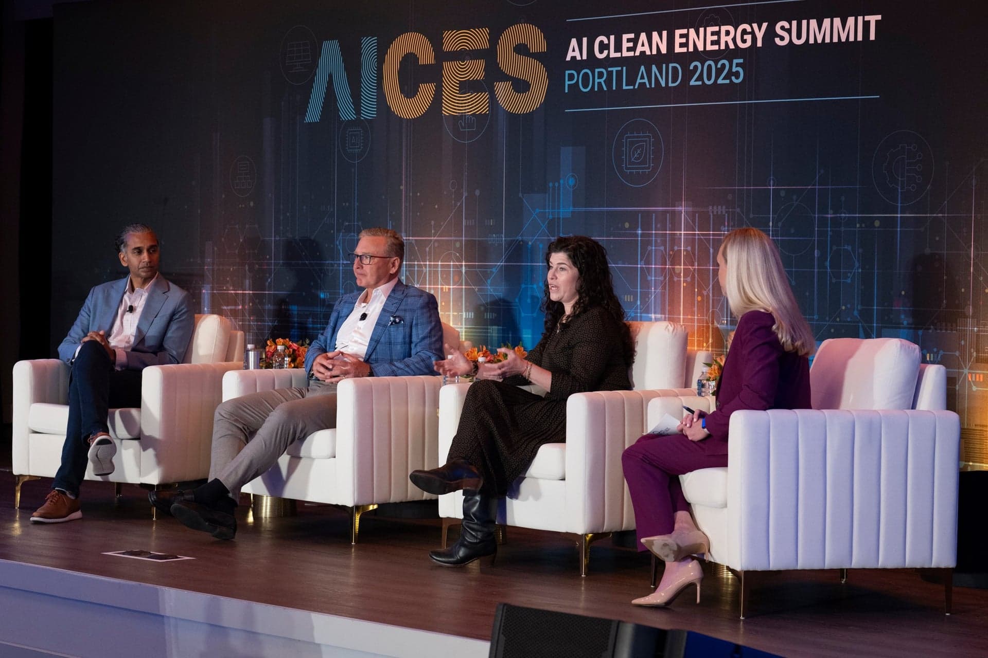 Conference panel on stage at a Portland event