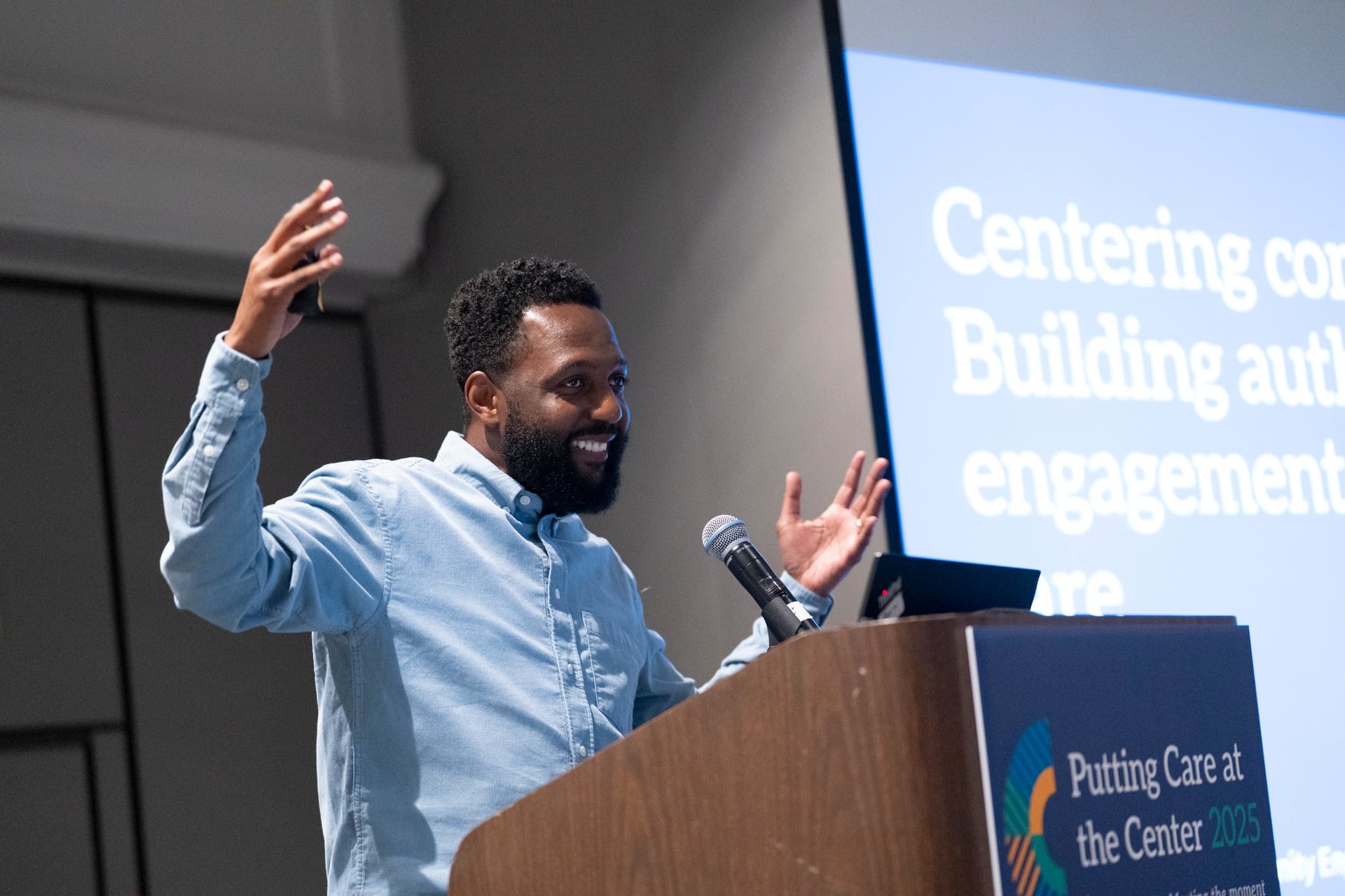 Event videography capturing speaker on stage at Portland event